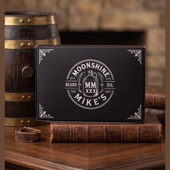 Fort Denaud Beard and Skin Moonshine Mike's beard oil gift set in a black box on a wooden desk with a barrel.