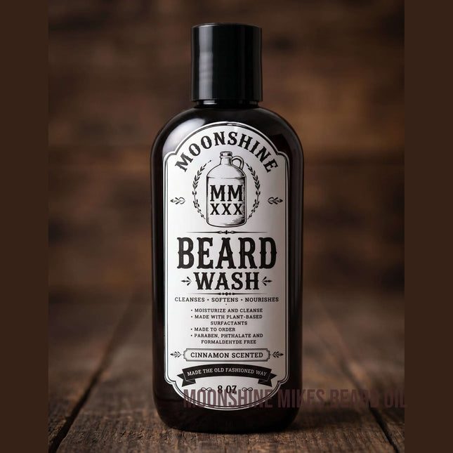 Fort Denaud Beard and Skin Moonshine Mike's cinnamon scented beard wash in a black bottle on a rustic wooden surface.