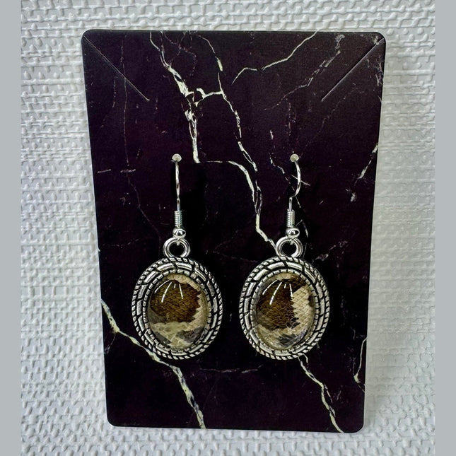 Fort Denaud Beard and Skin oval drop earrings featuring a textured silver rope frame and a snakeskin pattern inlay.