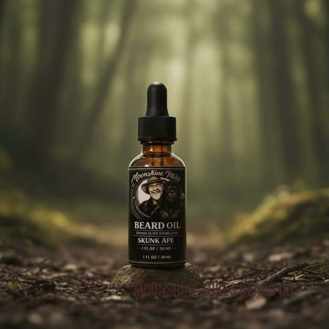Fort Denaud Beard and Skin Skunk Ape beard oil in a 30ml amber glass dropper bottle set on a mossy rock in a forest.