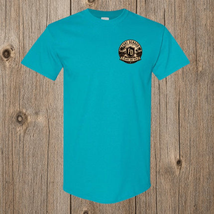 Fort Denaud Beard and Skin turquoise cotton t-shirt with a circular logo graphic on the chest