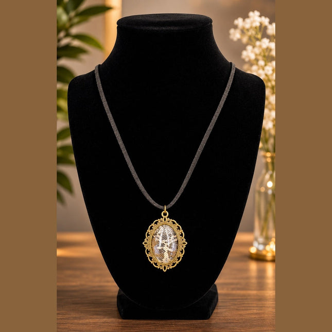 Fort Denaud Beard and Skin vintage style oval pendant necklace with antique gold filigree on a black cord